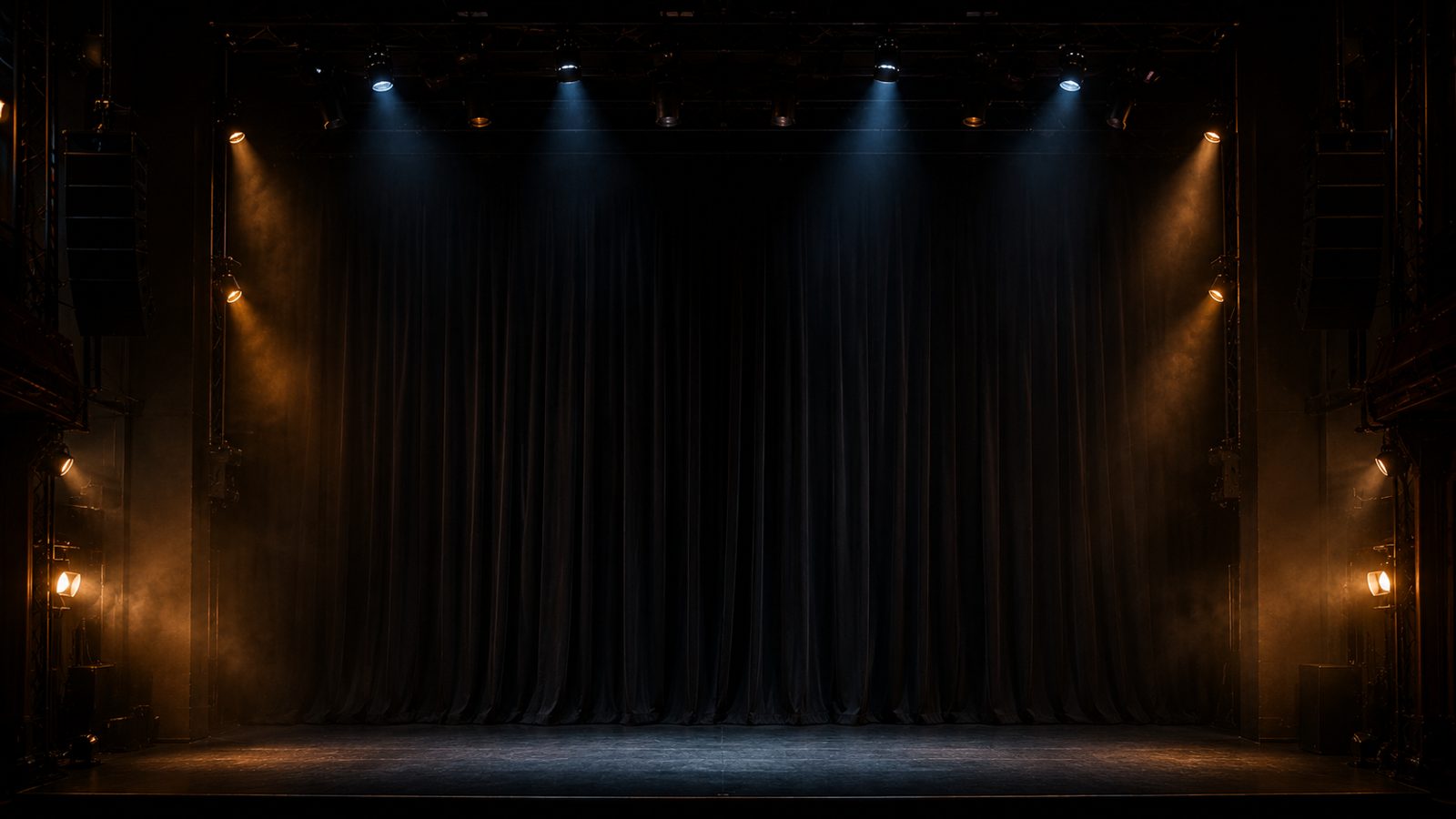 Deep black void drape masking the back and sides of a stage, absorbing light for an infinite black look