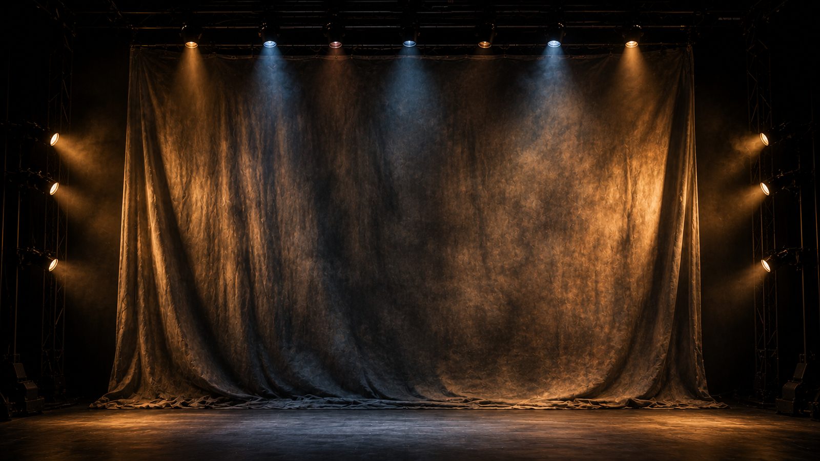 Wide seamless muslin backdrop hung flat on a stage, ready for lighting or projection